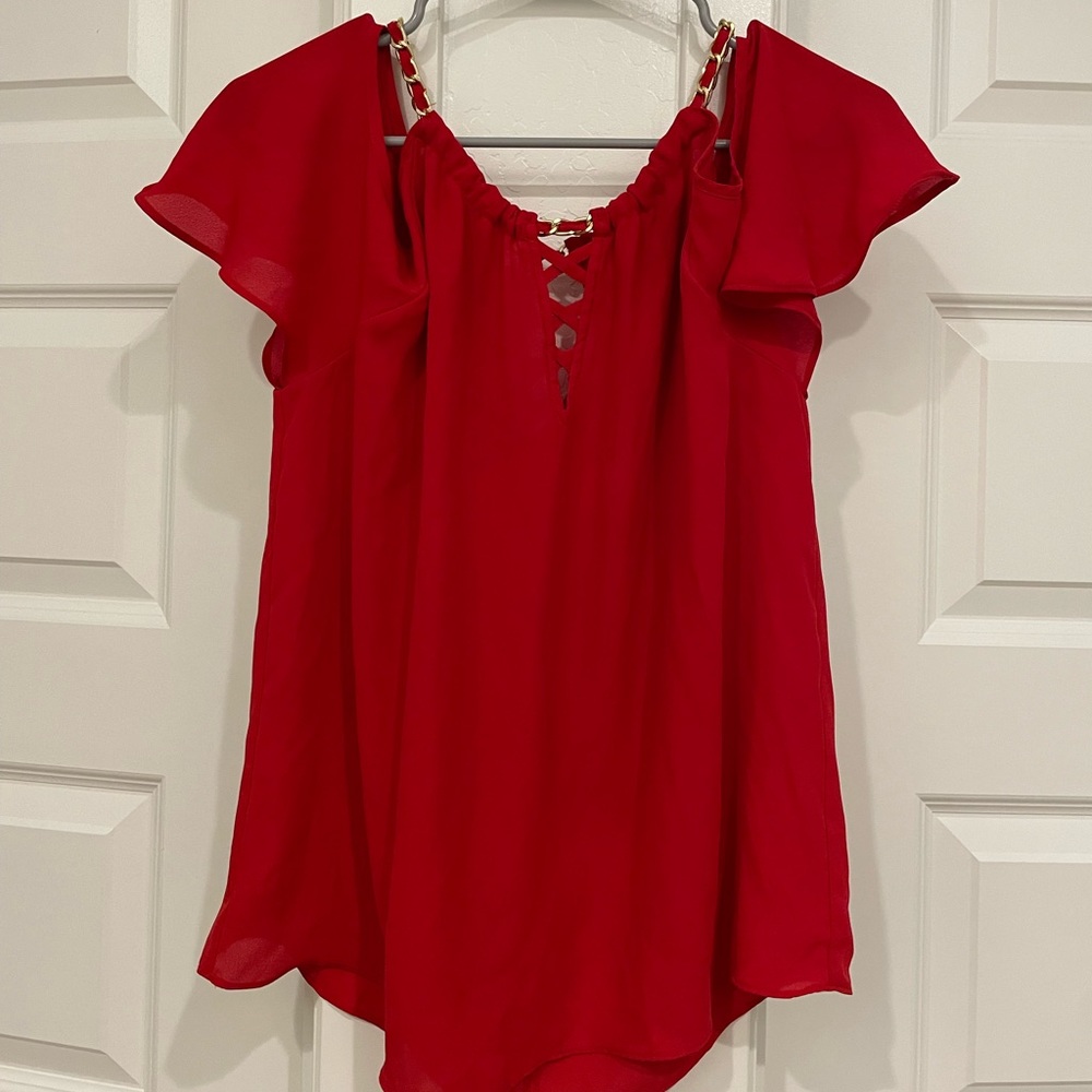 Red shirt with gold straps